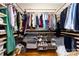 Organized walk-in closet with shelving for clothing and accessories at 2124 Chatham Ave, Charlotte, NC 28205