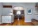 Bright dining room with hardwood floors, bench seating, an archway, and a view to the entryway at 2124 Chatham Ave, Charlotte, NC 28205