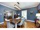 Charming dining room with hardwood floors, gray walls, and a modern light fixture at 2124 Chatham Ave, Charlotte, NC 28205
