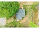 Aerial view of the home's roof surrounded by mature trees on a large grassy lot at 225 N Lee St, Mount Holly, NC 28120