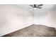 Cozy bedroom featuring wood-look flooring, a ceiling fan, closet and a neutral color palette at 225 N Lee St, Mount Holly, NC 28120