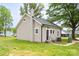 Charming single-story home with neutral siding, well-kept lawn, and mature trees at 225 N Lee St, Mount Holly, NC 28120