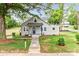 Charming bungalow-style home with a well-manicured lawn and inviting front porch at 225 N Lee St, Mount Holly, NC 28120