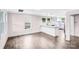 A bright kitchen features granite countertops, modern pendant lighting, and luxury vinyl flooring at 225 N Lee St, Mount Holly, NC 28120