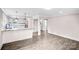 Open floor plan kitchen with granite countertops, modern lighting, and luxury vinyl plank flooring at 225 N Lee St, Mount Holly, NC 28120