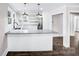 Open floor plan kitchen with granite countertops, modern lighting, and luxury vinyl plank flooring at 225 N Lee St, Mount Holly, NC 28120