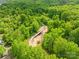 Aerial view of bridge construction surrounded by dense foliage and natural landscape at 229 River Birch Cir, Mooresville, NC 28115