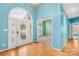 Bright foyer with beautiful chandelier, grand entry door, and hardwood floors at 229 River Birch Cir, Mooresville, NC 28115