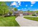 Well-maintained home with a winding driveway, attached garage, and lush green lawn at 229 River Birch Cir, Mooresville, NC 28115