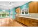 Bright kitchen featuring wooden cabinets, stainless steel appliances, and hardwood floors at 229 River Birch Cir, Mooresville, NC 28115
