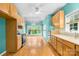 Bright kitchen featuring wooden cabinets, stainless steel appliances, and hardwood floors, with lots of natural light at 229 River Birch Cir, Mooresville, NC 28115