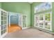 Sun-filled room with french doors, high ceilings, and large windows overlooking greenery at 229 River Birch Cir, Mooresville, NC 28115