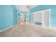 Spacious living room featuring built-in shelving, an open entry, and plush carpeting at 229 River Birch Cir, Mooresville, NC 28115