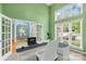 Inviting office space with large windows, a modern desk setup, and a view into other parts of the home at 229 River Birch Cir, Mooresville, NC 28115