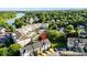 Beautiful aerial view of townhomes with a waterfront backdrop, community pool, and lush greenery at 245 Rock Ridge Ln, Mount Holly, NC 28120