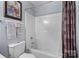 Simple bathroom with a shower-tub combo, chrome fixtures, and tile flooring at 245 Rock Ridge Ln, Mount Holly, NC 28120