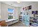 Bright bedroom with a large window, white trim, and personal touches at 245 Rock Ridge Ln, Mount Holly, NC 28120