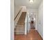 Inviting entryway featuring hardwood floors, staircase, and access to living spaces at 245 Rock Ridge Ln, Mount Holly, NC 28120