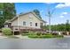View of Tailrace Marina building, with accessible ramps, landscaping, and waterfront views at 245 Rock Ridge Ln, Mount Holly, NC 28120