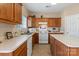 Cozy kitchen features an island, ample counter space, and modern appliances, perfect for cooking at 245 Rock Ridge Ln, Mount Holly, NC 28120