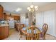 Bright kitchen with dining area, ample cabinet space, and modern appliances for efficient cooking at 245 Rock Ridge Ln, Mount Holly, NC 28120