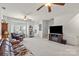 Open living room featuring natural light, neutral walls, plush carpet, and a cozy sitting area at 245 Rock Ridge Ln, Mount Holly, NC 28120