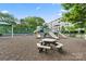 Playground with slides, picnic tables, and a covered area, next to a tennis court and apartments at 245 Rock Ridge Ln, Mount Holly, NC 28120