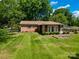 Spacious backyard featuring a well-maintained lawn and natural surroundings at 2808 Findley Rd, Statesville, NC 28625