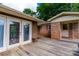 Wooden deck connecting a house and a brick outbuilding at 2808 Findley Rd, Statesville, NC 28625