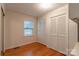 Cozy bedroom with hardwood floors, built-in closet, and natural light at 2808 Findley Rd, Statesville, NC 28625