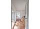Hallway with terra cotta floors, natural lighting, and access to outdoor spaces at 2808 Findley Rd, Statesville, NC 28625