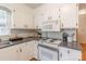 Charming kitchen featuring white cabinets, gray countertops, and stainless steel appliances at 2808 Findley Rd, Statesville, NC 28625