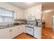 Efficient kitchen featuring white cabinetry, dark countertops and stainless steel appliances at 2808 Findley Rd, Statesville, NC 28625
