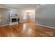 Bright living room featuring hardwood floors, a decorative fireplace and a large window at 2808 Findley Rd, Statesville, NC 28625
