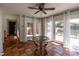 Bright sunroom featuring tile floors, a glass table, and access to outdoor living spaces at 2808 Findley Rd, Statesville, NC 28625