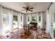 Cozy sunroom with tile floors and ample natural light, ideal for relaxation at 2808 Findley Rd, Statesville, NC 28625