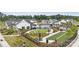 Aerial view showcasing the community amenities, including the pool, bocce ball, and fire pit at 320 Basil Dr, Indian Trail, NC 28079