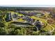 Aerial view showcases homes, ponds, walking trail, and green spaces in the community at 320 Basil Dr, Indian Trail, NC 28079