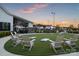 Community gathering area with lounge chairs and manicured artificial turf at 320 Basil Dr, Indian Trail, NC 28079