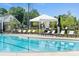 Inviting community pool with lounge chairs and shaded cabana at 320 Basil Dr, Indian Trail, NC 28079
