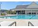 Community pool with swimming pool regulations sign and chairs at 320 Basil Dr, Indian Trail, NC 28079