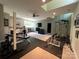 Spacious basement gym with exercise equipment, weights, and a ceiling fan at 3201 Johnny Cake Ln, Charlotte, NC 28226