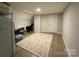 Finished basement featuring a neutral colored rug and wood-look floors at 3201 Johnny Cake Ln, Charlotte, NC 28226