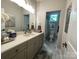 Bathroom with light gray cabinets, double sinks, and modern fixtures at 3201 Johnny Cake Ln, Charlotte, NC 28226
