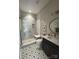 Beautiful bathroom featuring a glass enclosed shower with subway tile and patterned tile flooring at 3201 Johnny Cake Ln, Charlotte, NC 28226