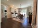 Bright dining room with a modern light fixture and large window at 3201 Johnny Cake Ln, Charlotte, NC 28226