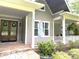 Inviting home exterior with a covered porch and meticulously maintained landscaping enhancing curb appeal at 3201 Johnny Cake Ln, Charlotte, NC 28226