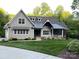 Well-maintained home features a lush green lawn and a cozy front porch, perfect for enjoying the outdoors at 3201 Johnny Cake Ln, Charlotte, NC 28226