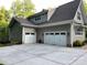 Spacious three-car garage with ample parking space and a well-maintained exterior at 3201 Johnny Cake Ln, Charlotte, NC 28226