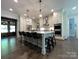 Spacious kitchen boasts stainless appliances, a large island, and hardwood floors at 3201 Johnny Cake Ln, Charlotte, NC 28226